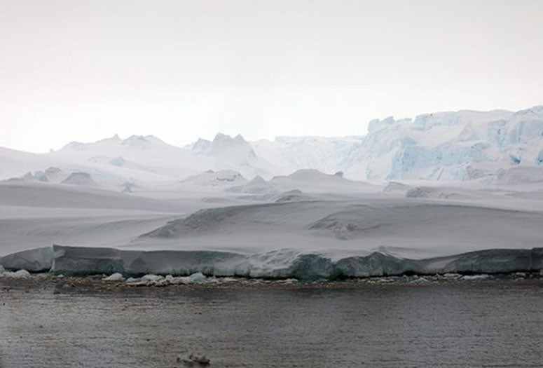 Blocks of dense, blue ice the size of convenience stores can be seen breaking away from Thwaites Glacier in a February 2019 photograph taken from the deck of the research vessel Nathaniel B. Palmer. (Photo by Linda Welzenbach)