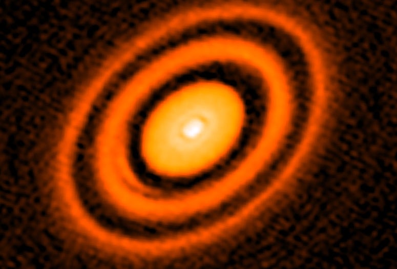 false-color image from the ALMA radio telescope showing a series of rings around young star HD163296 