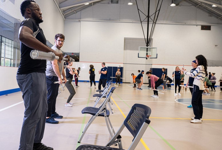 Faculty and staff learned Olympic weightlifting during a Wellness Wednesday on Jan. 29 in the Gibbs Center. Howard Hughes Provost Amy Dittmar led the session.