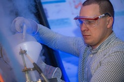 Rice University postdoctoral researcher Andrey Baydin prepares to run an experiment at RAMBO, the Rice Advanced Magnet with Broadband Optics, a tabletop spectrometer that allows materials to be cooled and exposed to high magnetic fields. The instrument helped uncover a phenomenon by which nonmagnetic phonons can be manipulated by a magnetic field. (Credit: Jeff Fitlow/Rice University)