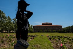 Maggie Tsang, a Wortham Fellow at Rice Architecture, pauses while planting the prairie garden she designed to demonstrate the aesthetic and environmental value of installing resilient, native plants instead of typical lawns.