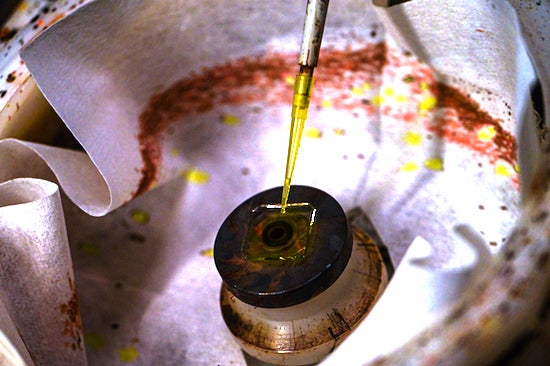 Rice University graduate student Siraj Sidhik prepares to spin-coat a substrate with a compound that solidifies into a 2D perovskite. Rice engineers have found the perovskite shows promise for efficient, robust solar cells. Photo by Jeff Fitlow