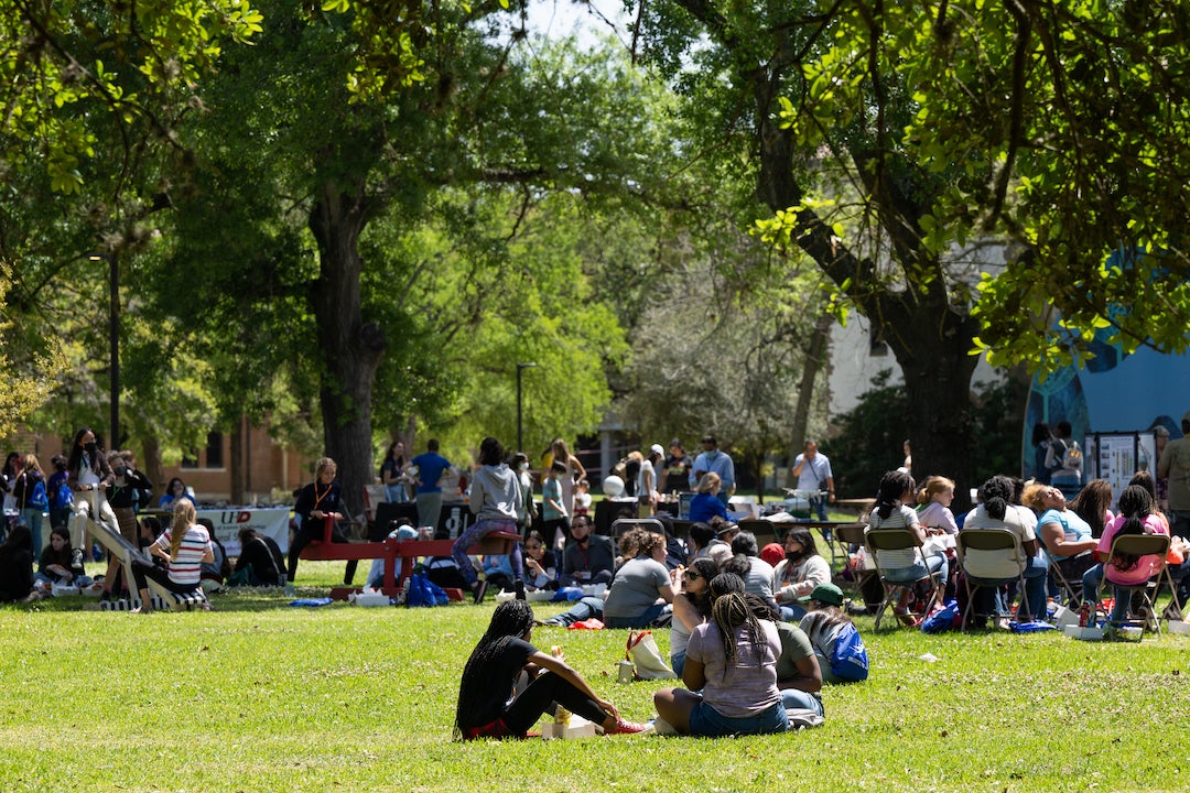 Students at Reach for the Stars festival sitting outside