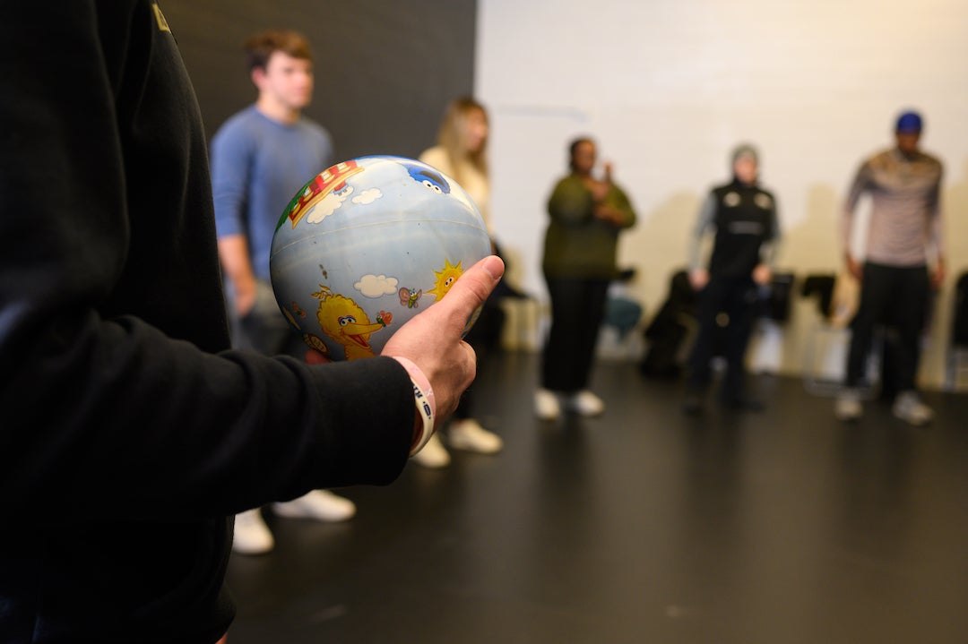 Acting students in circle during acting exercise led by Actors From The London Stage