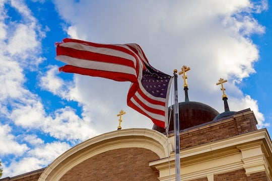 American flag and church