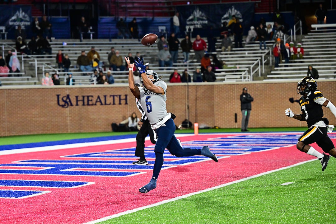 Rice supporters celebrate the Owls' 2022 LendingTree Bowl appearance in Mobile, Alabama.