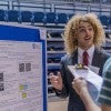 Rice student presenting research at past Rice Undergraduate Research Symposium